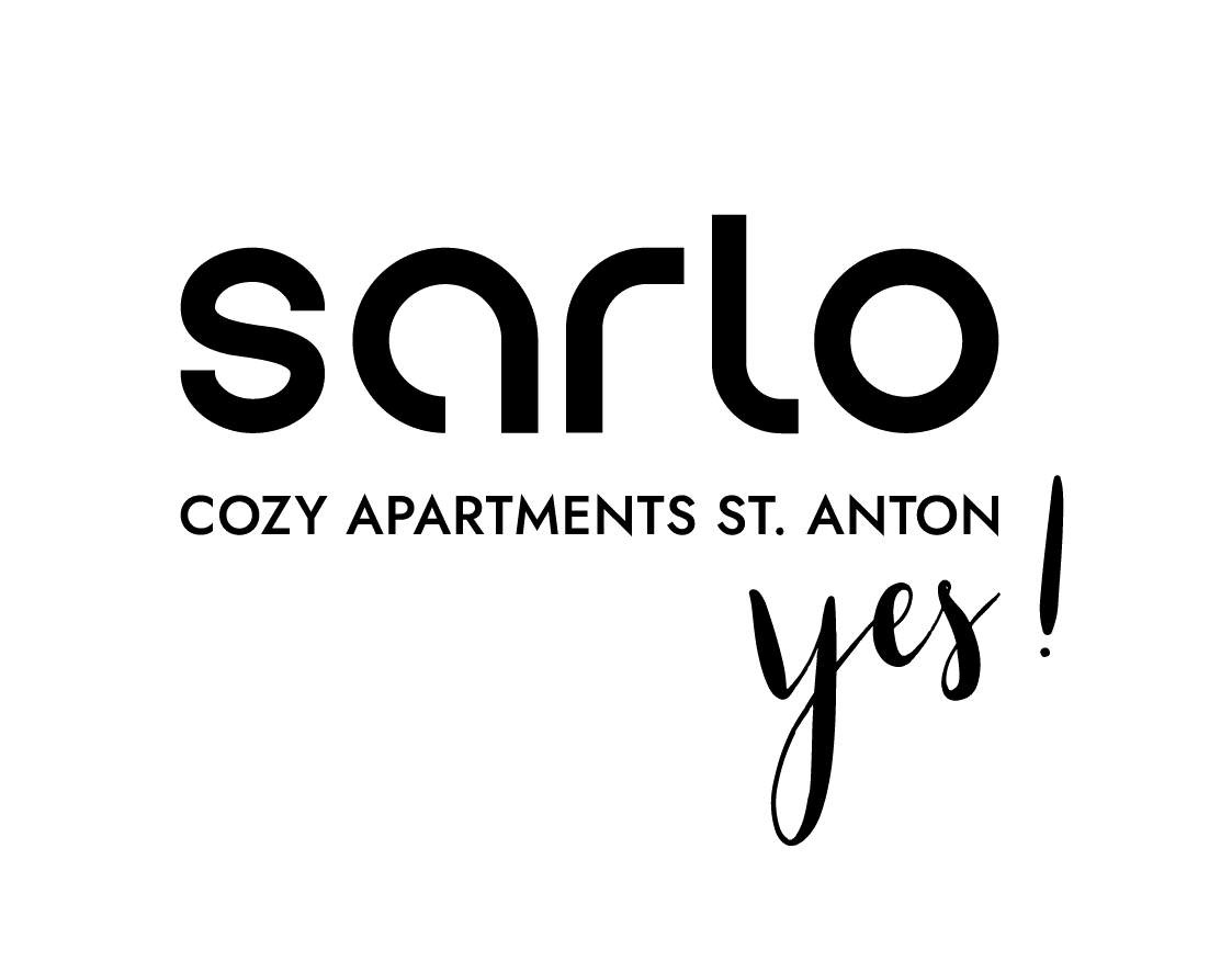Logo für sarlo cozy apartments St. Anton mit dem Wort yes! in Script-Schrift.
